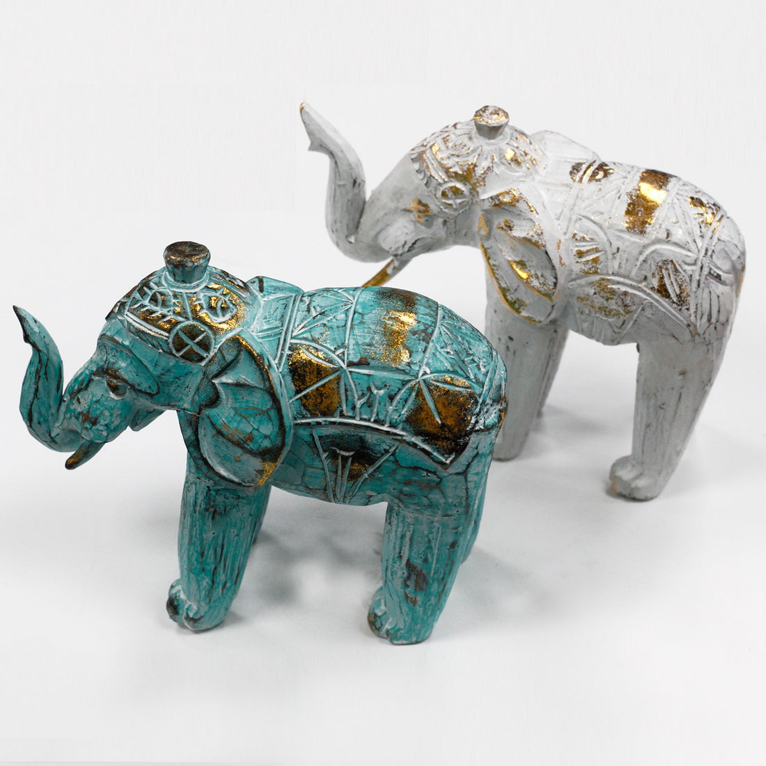 Elefante turquesa-oro en madera de albesia tallado a mano