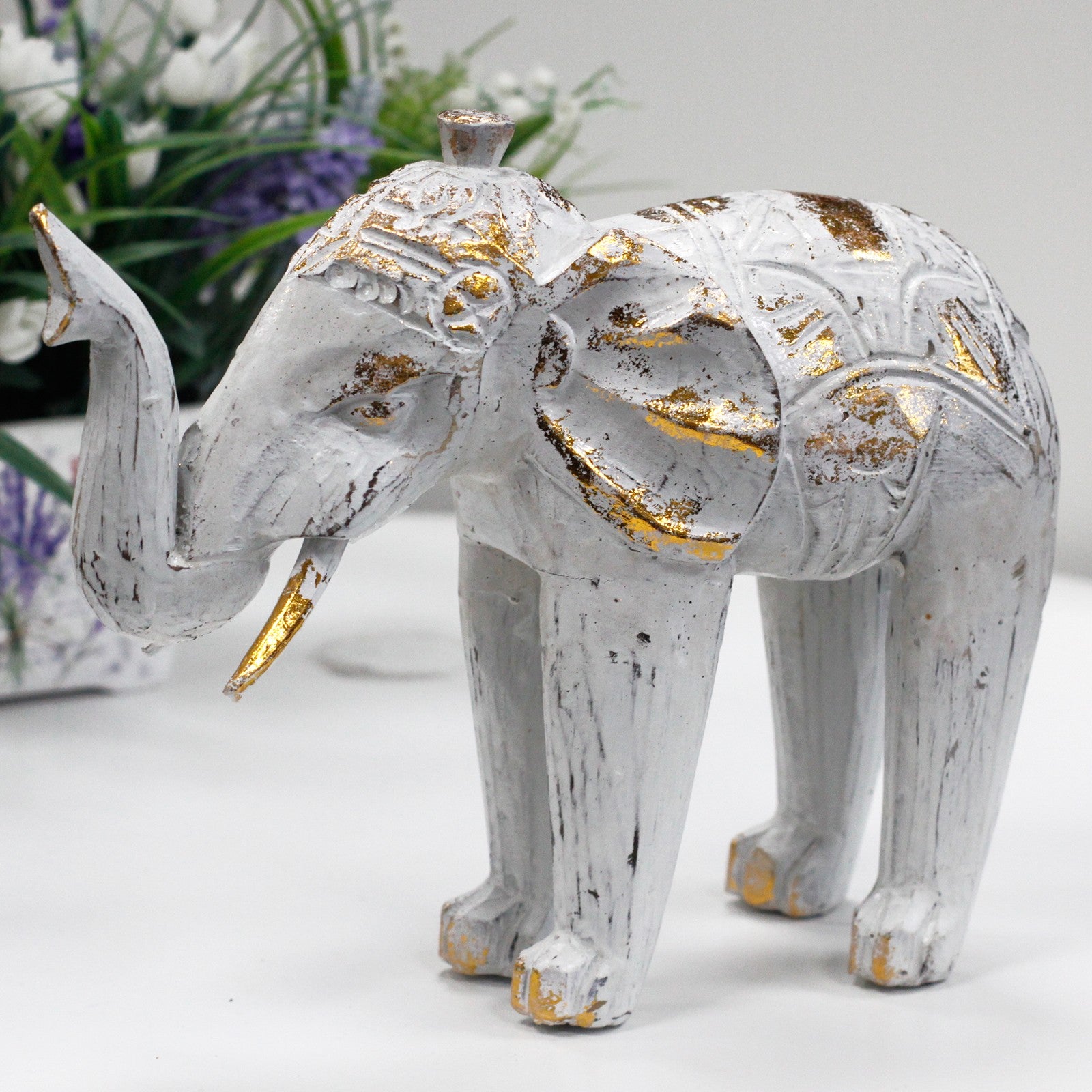 Elefante blanco-oro en madera de albesia tallado a mano
